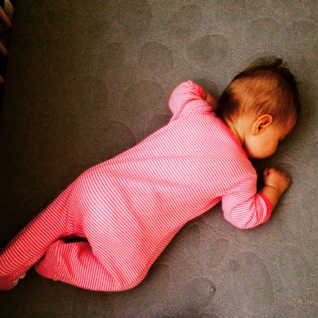 Baby sleeping in crib - sleep deprivation