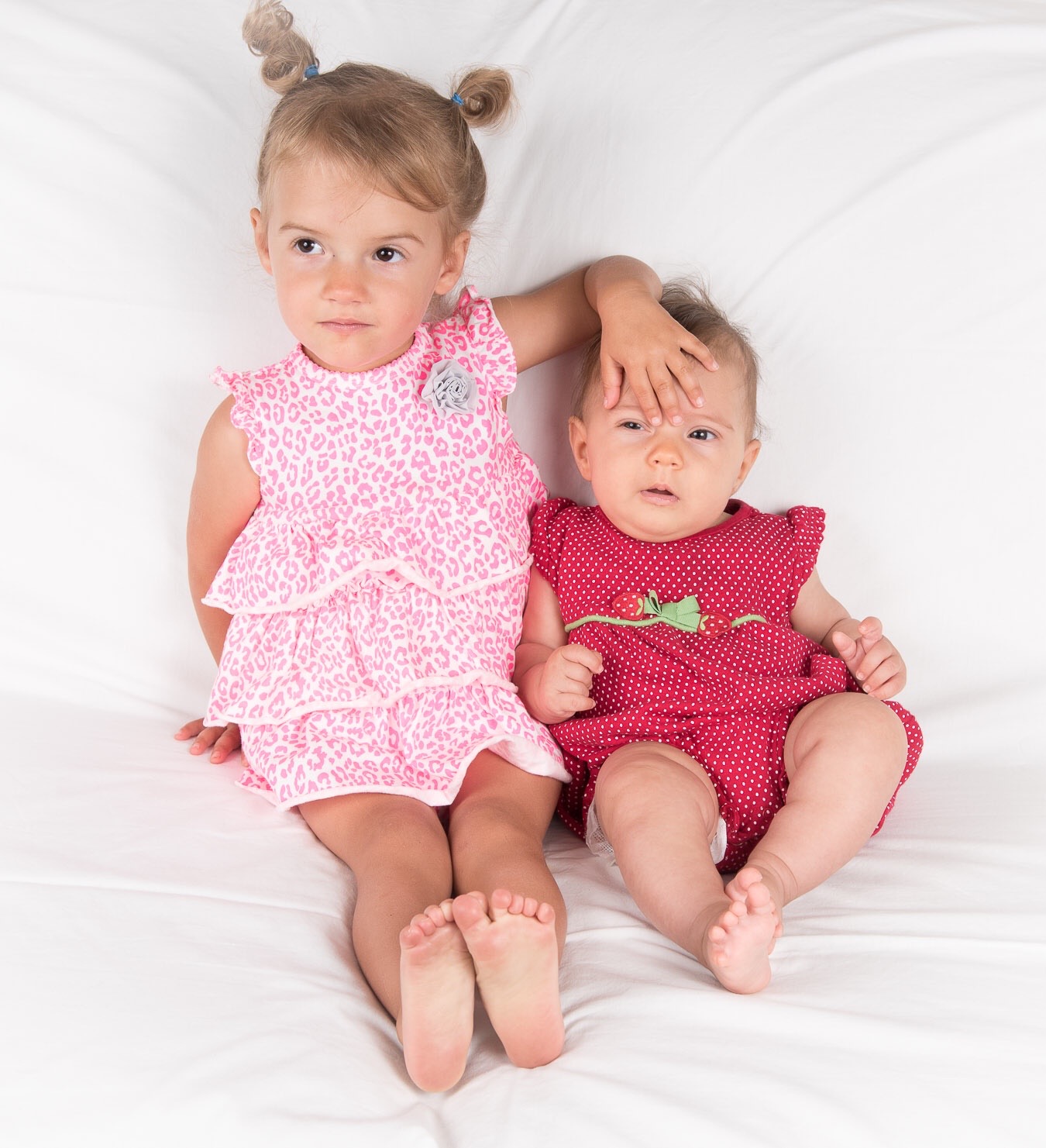 Sienna (2 years) with her younger sister (3 months)