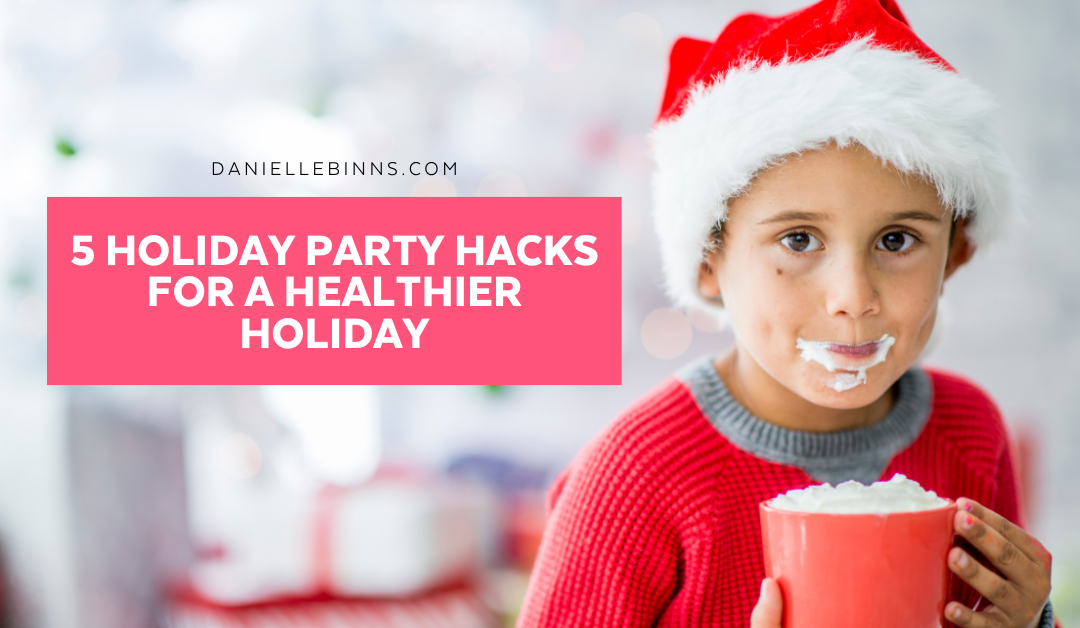A boy drinking hot cocoa with a santa hat on. Text reads: "5 holiday party hacks for a healthier holiday"